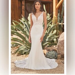 Cream beaded mermaid wedding dress brand new with tags.